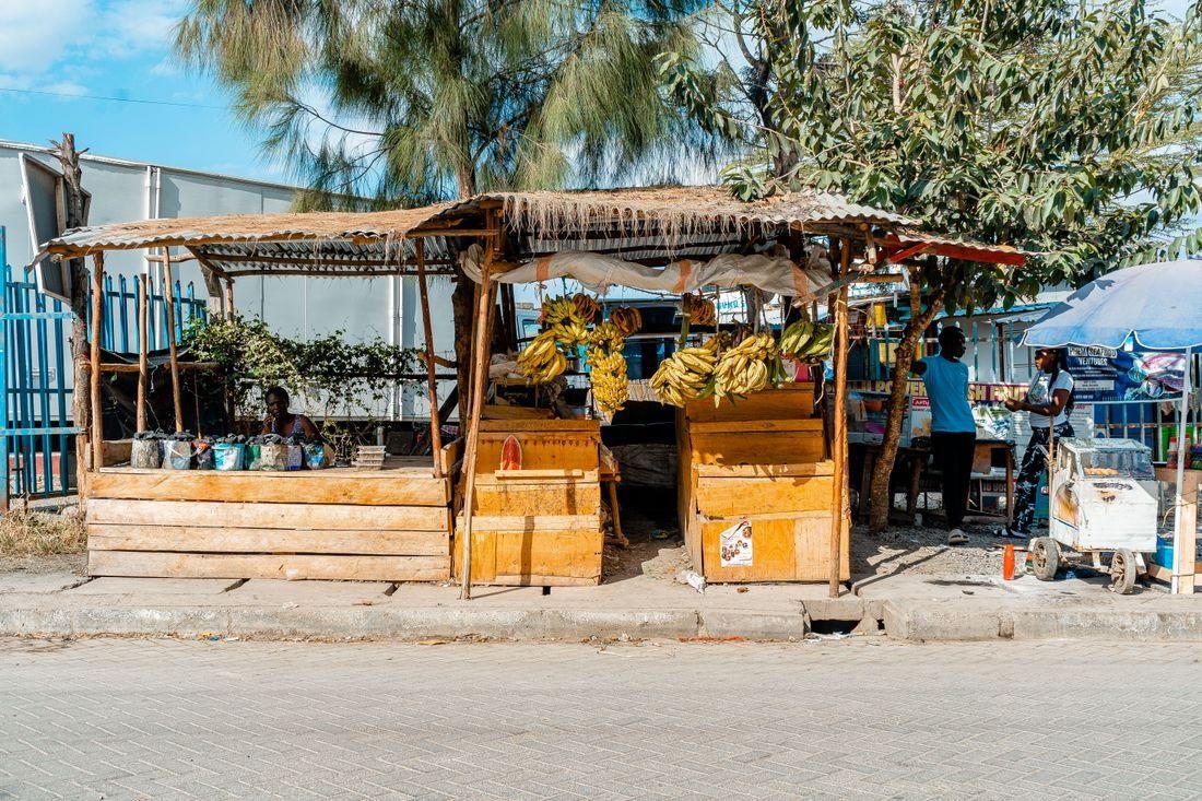 East African market trader at her small business stall