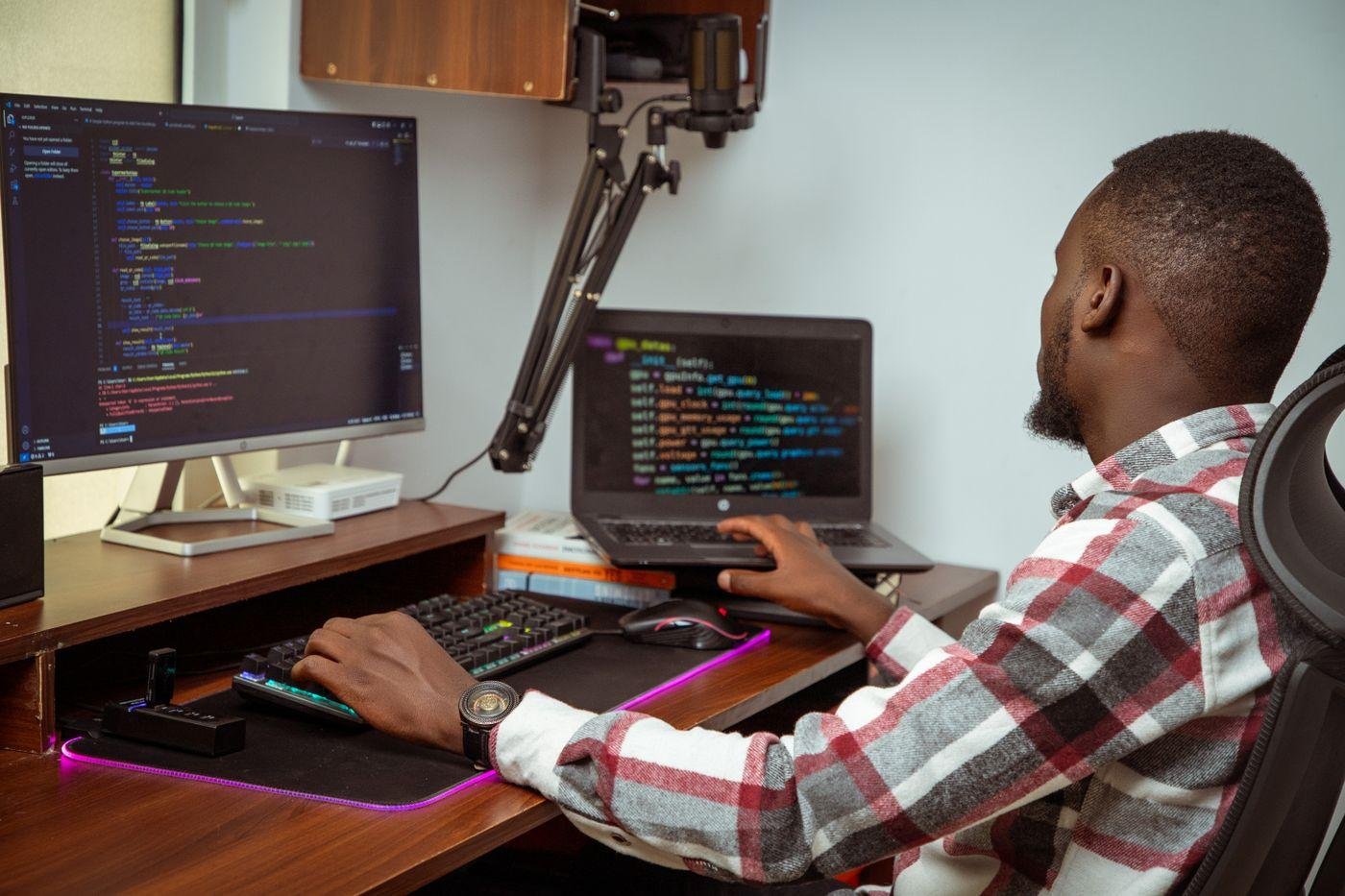 Youth innovator prototyping at a technical workstation